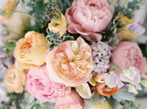 Soft Spring Florals Bouquet of soft pastel roses and peonies with greenery.
